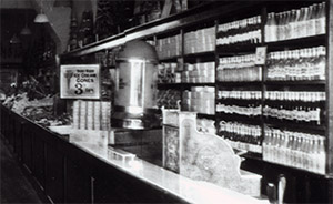 Ice-cream and bottled minerals (soft drinks) displayed on the Ground Floor at the Portsmouth Woolworth's, as the Manager tried to fill the void that had arisen since the Tea Bar was closed when a Restaurant opened upstairs.
