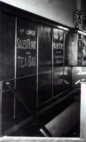 The Store Manager had signs painted on the stairs down from the Customer Restaurant encouraging diners to visit the 'main store along Commercial Road', a barbed criticism of the isolated location of the entrance dooors to the Tea Rooms