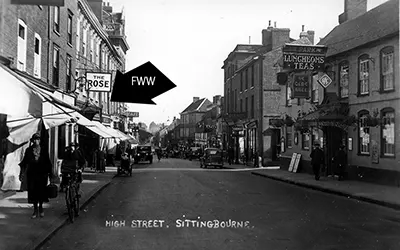 An oblique view of the F.W. Woolworth store in Sittingbourne High Street, next to the Rose Inn, once one of the most famous hostelries in England on the famous Roman Watling Street stretching from London to Dover via Canterbury
