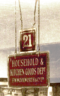 Sandblasted glass signs, with gold lettering and trim painted or stencilled in reverse on the back and then oversprayed with maroon paint guided shoppers to the principal counters, like Household and Kitchen Goods, around the store. A second smaller square sign showed the counter number, which was used to point customers in the right direction when they asked for help