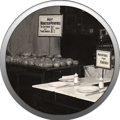 Simple but highly effective, Frank Picot's innovative display of baked potatoes, strategically located near the side entrance of the original Woolworth's in Brixton, changing its shopping pattern, relieving pressure from the front entrances and making the store easy to manage and fill up.