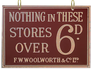 Sandblasted glass signs carrying the Nothing in these stores over Sixpence slogan were suspended from the ceiling at regular intervals in every F.W. Woolworth British and Irish Store from 1909 until 1940