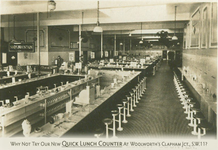Scratch-built from plans mailed over the USA, the British Woolworth's first attempt attempt at a Quick Lunch Counter, to test if it would be a viable alternative to its restaurants and tea bars, from a Souvenir Card issued at Clapham Junction (Store 34) in 1926