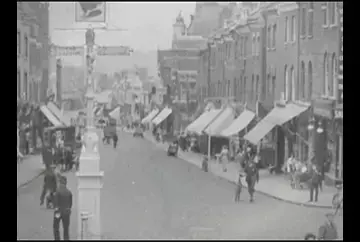 An animated view down Sutton High Street from the legendary Cock Inn to the new Woolworth's store at 96 High Street, circa 1920.
