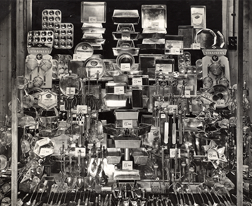 An elaborate window display of the wide selection of tinware that was available from Woolworth's in Poole, Dorset in 1928. The ranges proved particularly popular in the local fishing and handyman communities