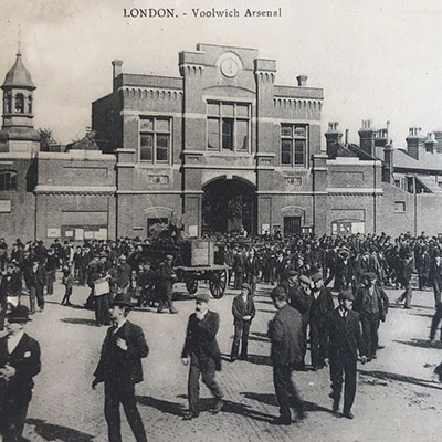 This postcard view from 1911 reveals that virtually all of the civilian workers outside the main gates at the Royal Arsenal, Woolwich were male