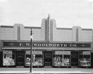One of the US Woolworth parent company's early attempts at a purpose-built store with an Art Deco frontage in Central Avenue, Albany, NY. The Corporation's Architects had adopted new state of the art one-way glass on the upper windows, that appeared to be cream glazed bricks from the street. The British follow-up at Clapham Junction incorporated the faence front and the porticos, but opted for elegant, perfectly symmetrical brass window frames, making the frontage appear taller and wider.