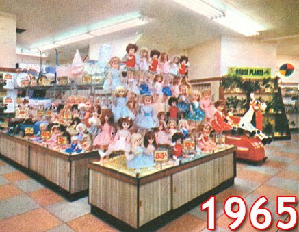 A new look Woolworth toy department with a spectacular display of dolls photographed in full colour. The shot shows the Gallowtree Gate branch in Leicester in 1965.